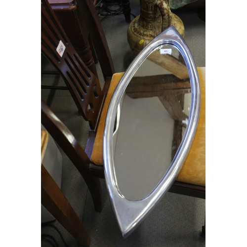 445 - A polished aluminium framed oval wall mirror, 31