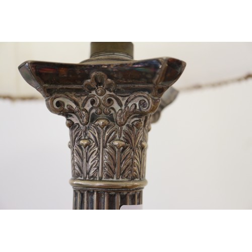 210 - A silver plated table lamp, formed as a column, on stepped base, 17 1/2