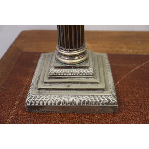 210 - A silver plated table lamp, formed as a column, on stepped base, 17 1/2