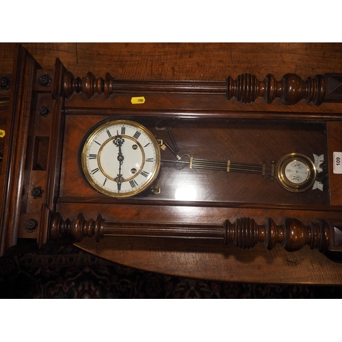 119 - An American cased wall clock with glazed panels and eight-day striking movement, 42