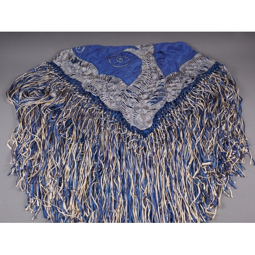 188 - An early 20th century blue silk shawl with ribbon and tassel decoration, 44