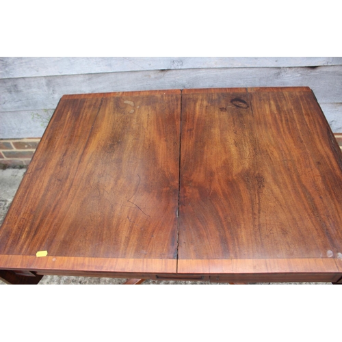 445 - An early 19th century mahogany and satinwood banded sofa table, fitted two frieze drawers, on square... 