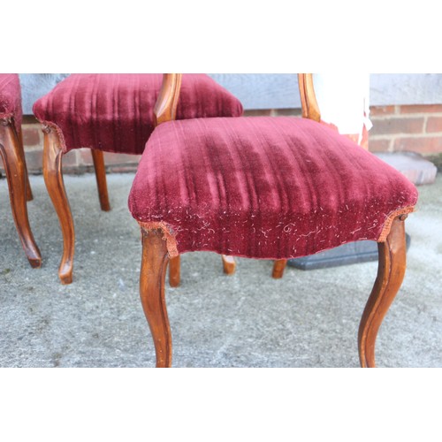 450 - A set of four late 19th century walnut loop back dining chairs with stuffed over seats, upholstered ... 