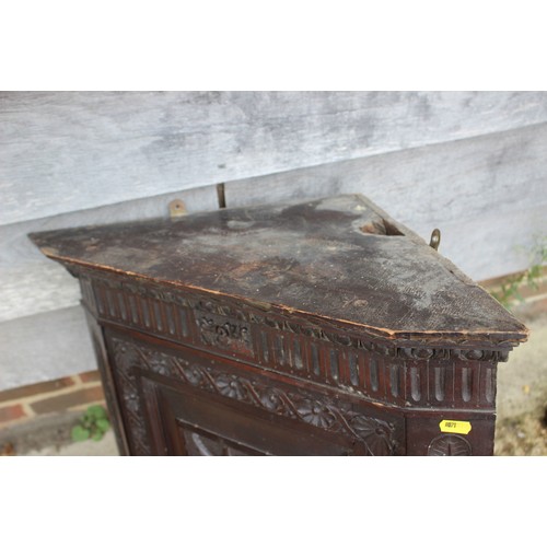 472 - A late 19th century carved mahogany corner hanging cupboard enclosed panel door, 22 1/2