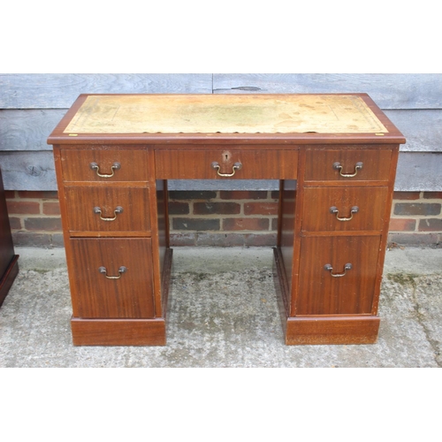 534 - A sapele mahogany double pedestal desk with cream leather lined top, fitted seven drawers, 41 1/2