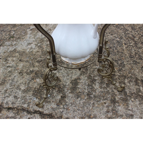 538 - An early 20th century brass washstand with ceramic bowl and jug, 19