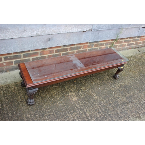 556 - A carved mahogany long low stool, on cabriole claw and ball supports, 15