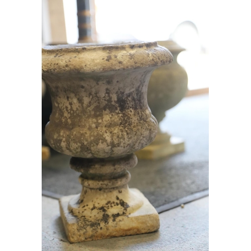 597 - A marble campana urn, on square base