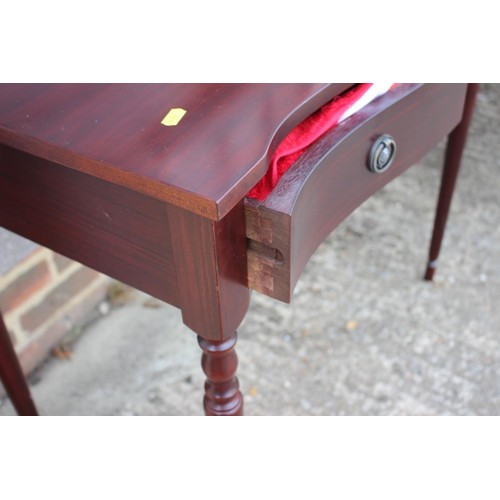 526 - A mahogany oval drop leaf table, fitted one deep drawer, on tapering supports, 36