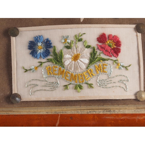 241 - A collection of eighteen WWI silk embroidered post cards, in two maple frames