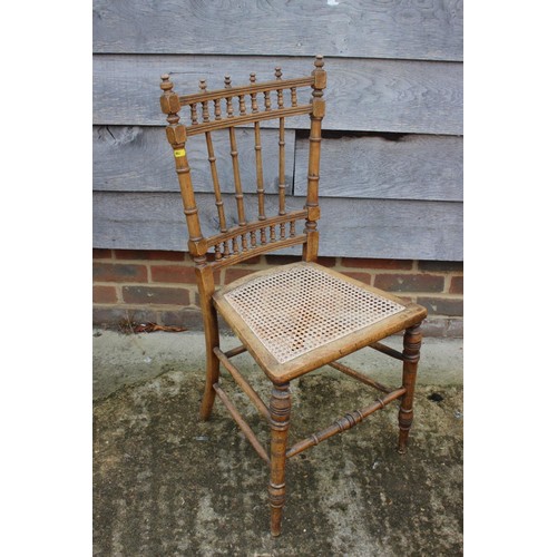 453 - A mahogany ladder back chair of George III design with scroll carved arms and padded seat, on moulde... 