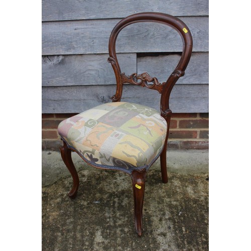 453 - A mahogany ladder back chair of George III design with scroll carved arms and padded seat, on moulde... 