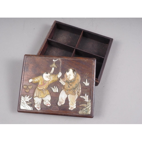 103 - A Japanese hardwood four section box with inset mother-of-pearl and wooden figure decoration. 6 1/2