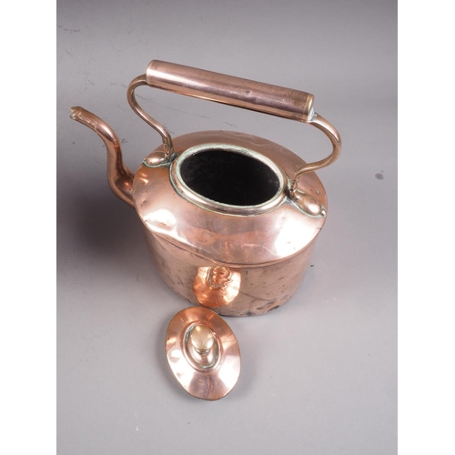 150 - A 19th century copper kettle and heated stand, 15