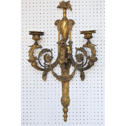 152 - A pair of late 18th century ormolu three-branch wall lights with eagle heads, acanthus scrolls and s... 