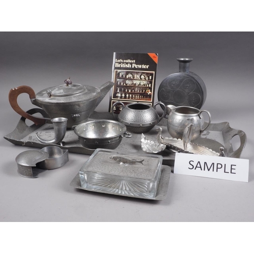 157 - A quantity of pewter, including trays, teapots, a page blotter, a tobacco jar, a sardine dish and ot... 