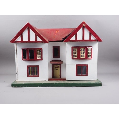 180 - A 1950s dolls house with opening front, 23