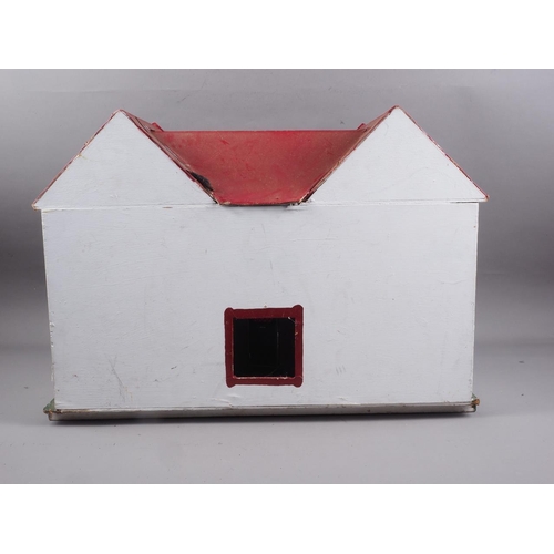 180 - A 1950s dolls house with opening front, 23