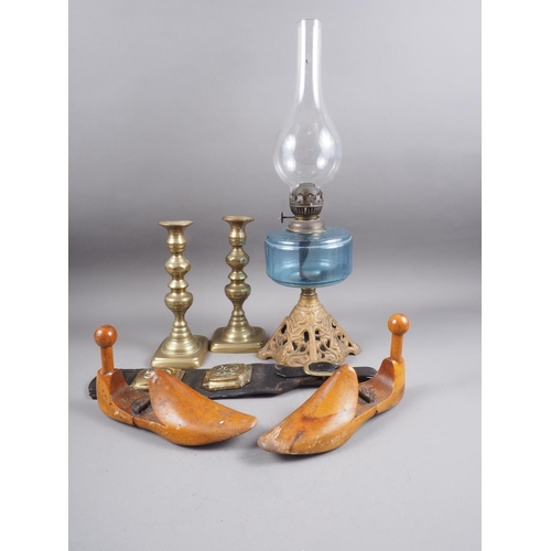 199 - A pair of 19th century brass candlesticks, a pair of wooden shoe lasts, a leather and brass chest st... 