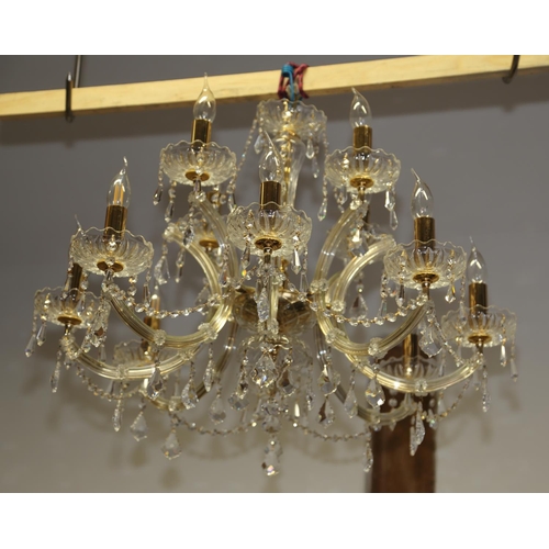 230 - A cut glass twelve-light eight-branch chandelier with swags and pendant drops, 30