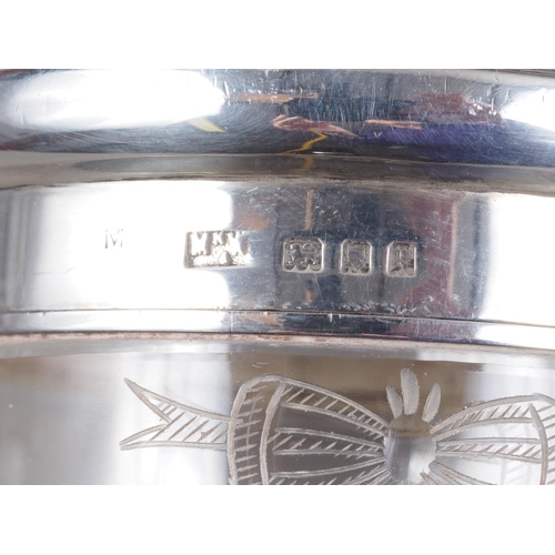 261 - Three dressing table jars with engine turned and yellow metal mounted silver lids