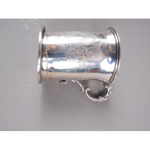 294 - A Victorian silver mug with engraved and initialled decoration, 3 1/2