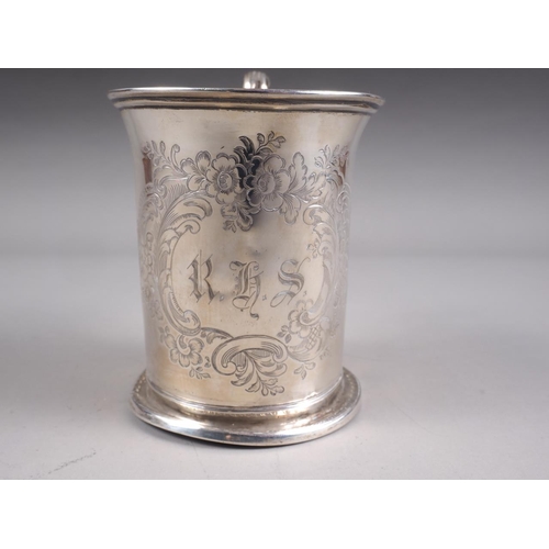 294 - A Victorian silver mug with engraved and initialled decoration, 3 1/2