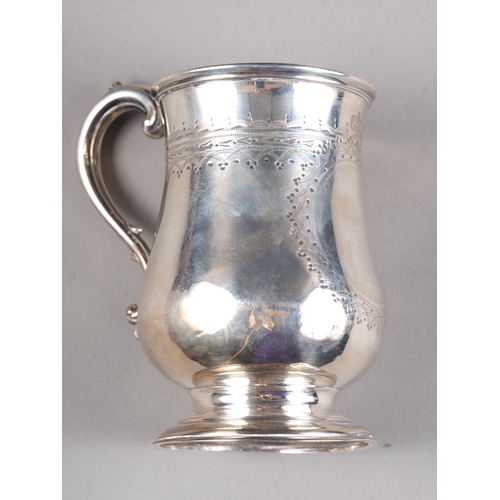 295 - A Victorian silver mug with engraved decoration, 3 3/4