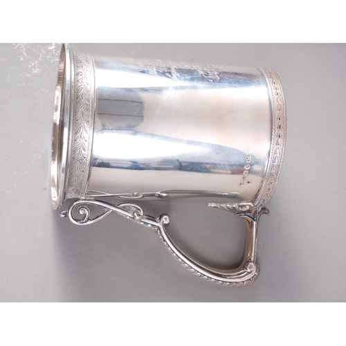 297 - A Victorian silver presentation tankard with engraved decoration, 4 3/4