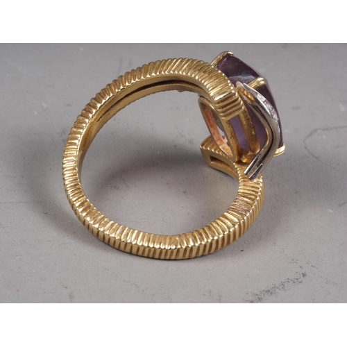 300 - An 18ct gold ring, set amethyst and white sapphire