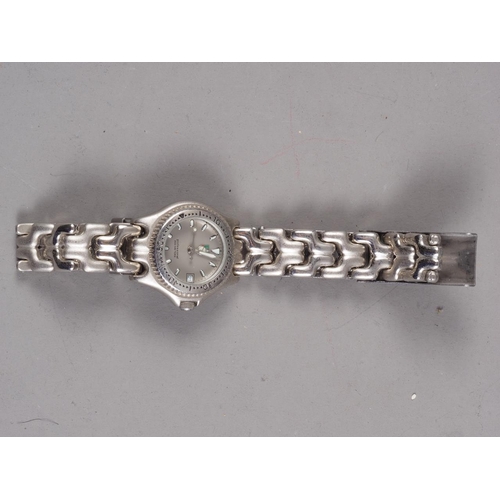 312 - A lady's Tag Heuer wristwatch with stainless steel bracelet