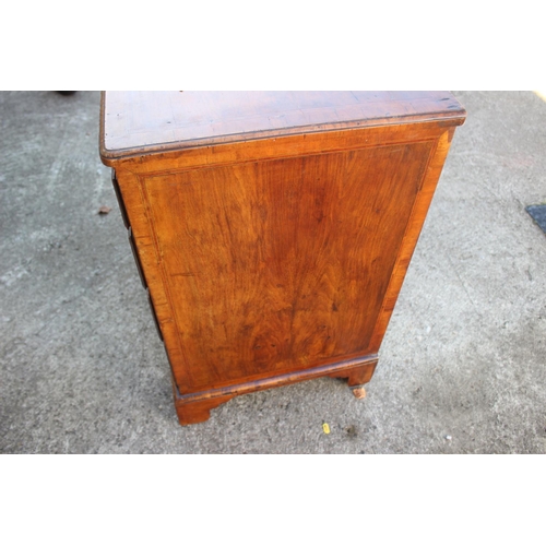 423 - A bachelor's Georgian walnut and banded box and ebony strung chest of four long graduated drawers wi... 