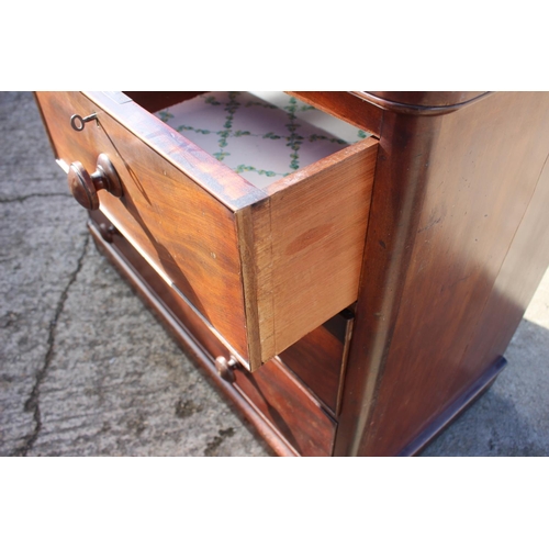 429 - A Victorian mahogany chest of two short and two long graduated drawers with knob handles, on block b... 