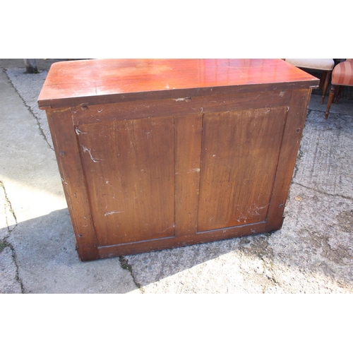 429 - A Victorian mahogany chest of two short and two long graduated drawers with knob handles, on block b... 