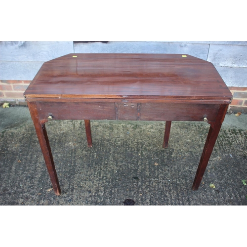 433 - A 19th century mahogany, ebony strung and satinwood banded fold-over top tea table, on reeded taperi... 