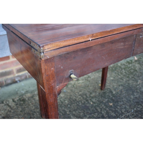 433 - A 19th century mahogany, ebony strung and satinwood banded fold-over top tea table, on reeded taperi... 