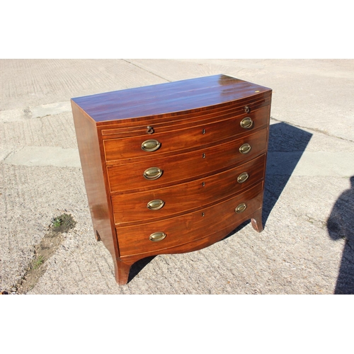 440 - A bachelor's Georgian mahogany box line inlaid bowfront chest of four long graduated drawers with ov... 