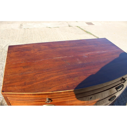 440 - A bachelor's Georgian mahogany box line inlaid bowfront chest of four long graduated drawers with ov... 