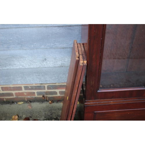 459 - A 19th century display cabinet enclosed two arch top glazed doors, on drop front base, 36