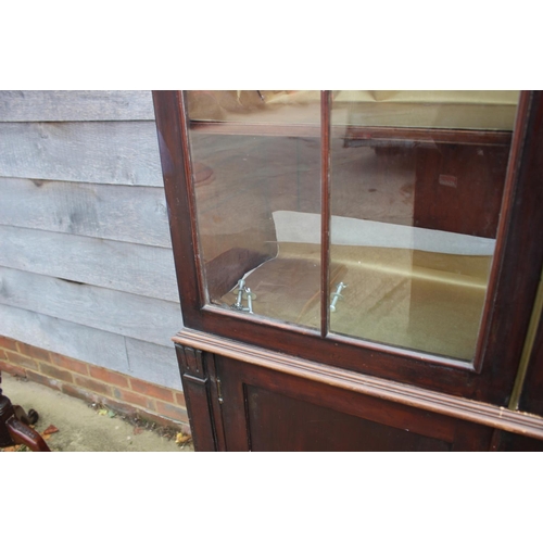 462 - A 19th century mahogany display cabinet, the upper section enclosed two Gothic lattice glazed doors ... 