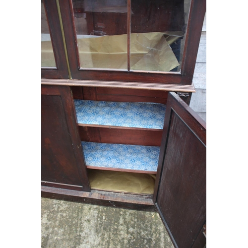 462 - A 19th century mahogany display cabinet, the upper section enclosed two Gothic lattice glazed doors ... 