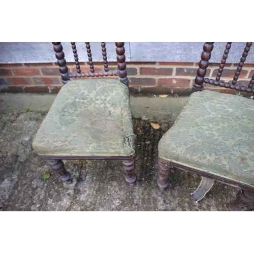 465 - A pair of 19th century rosewood bobbin turned low seat nursing chairs, on turned supports