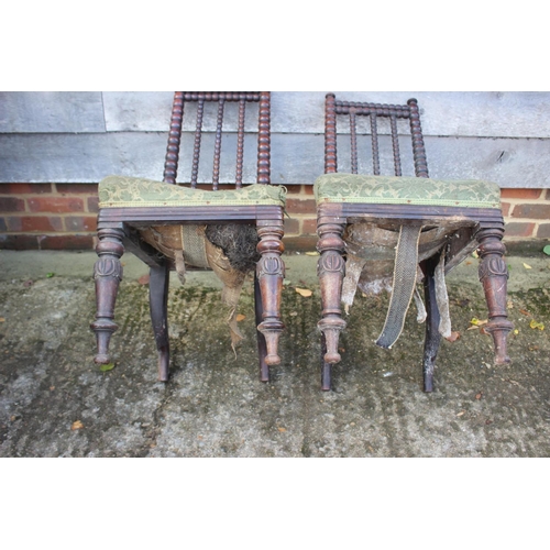 465 - A pair of 19th century rosewood bobbin turned low seat nursing chairs, on turned supports