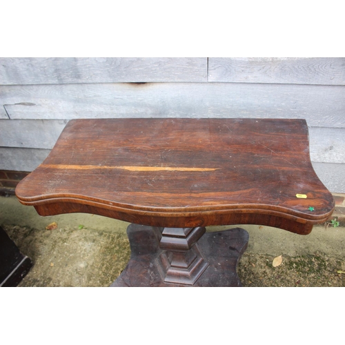 468 - A mid Victorian rosewood serpentine front fold-over top tea table, on shaped column and quatreform b... 