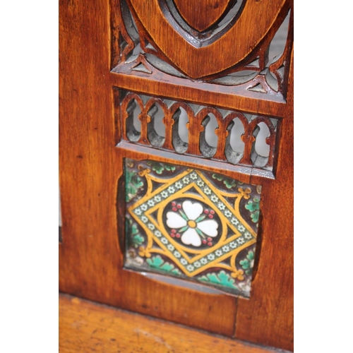 475 - A mid 19th century carved oak hall chair, inset Minton Hollins encaustic tile, with panel seat, on t... 