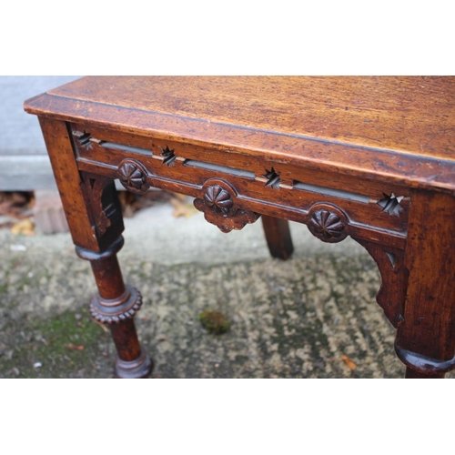 475 - A mid 19th century carved oak hall chair, inset Minton Hollins encaustic tile, with panel seat, on t... 