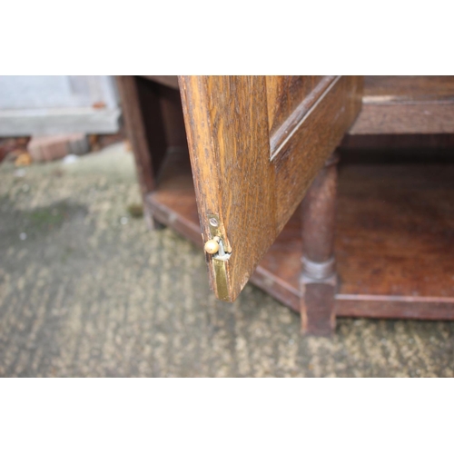 477 - An Arts & Crafts Liberty & Co quartercut oak dresser, the upper section fitted two open shelves flan... 