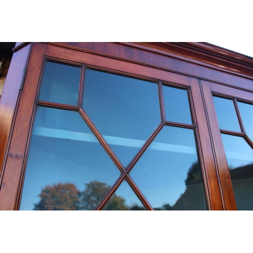 515 - A late 19th century corner display cabinet, upper section enclosed astragal glazed doors over cupboa... 