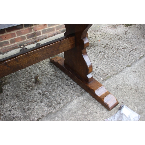 540 - An oak refectory dining table with planked top, on turned supports, 79 1/2