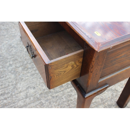 542 - An oak sideboard/carving table, fitted three drawers, on shaped supports, 48